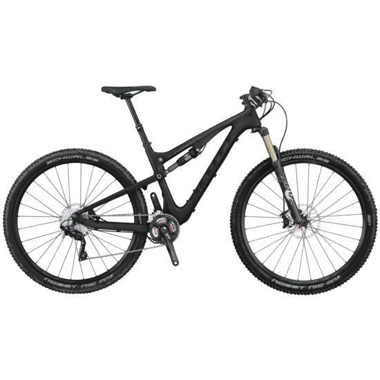 Scott Genius 910: A black mountain bike with a lightweight frame, equipped with front suspension, knobby tires, and disc brakes, positioned for a side view.