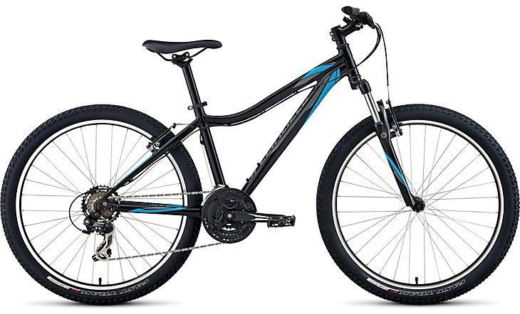 Specialized Myka 26: A black and blue mountain bike with thick tires, featuring a sturdy frame and a visible gear system, positioned upright against a neutral background.