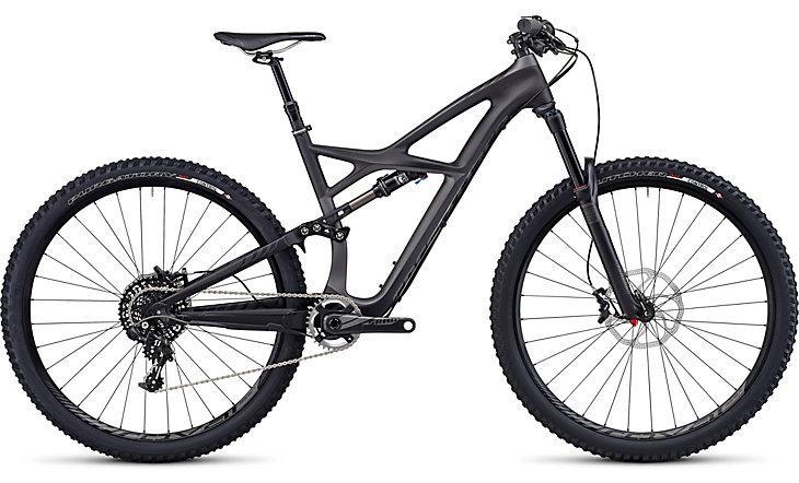 Specialized Enduro Expert Carbon 29: A modern mountain bike with a sleek black frame, featuring full suspension and wider tires designed for off-road performance. The bike showcases advanced design elements, including a complex rear triangle, disc brakes, and a precision gear system.