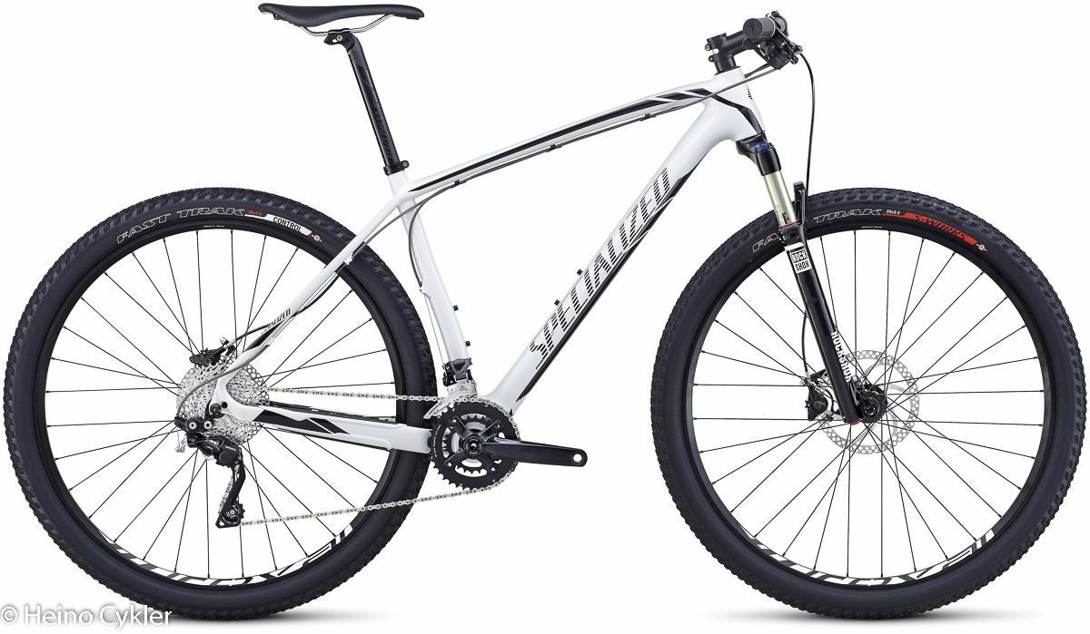 Specialized STUMPJUMPER COMP CARBON HT: Alt tag: "A modern white mountain bike with a lightweight frame, front suspension, and knobby tires, positioned on a white background."