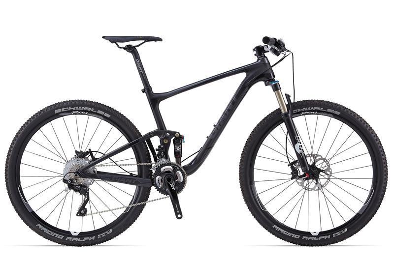 Giant Anthem Advanced 27.5 1: A sleek black mountain bike with a lightweight carbon frame, featuring front suspension and disc brakes. The bike has thin tires designed for cross-country riding, and its drivetrain includes multiple gears for versatility on varied terrain.