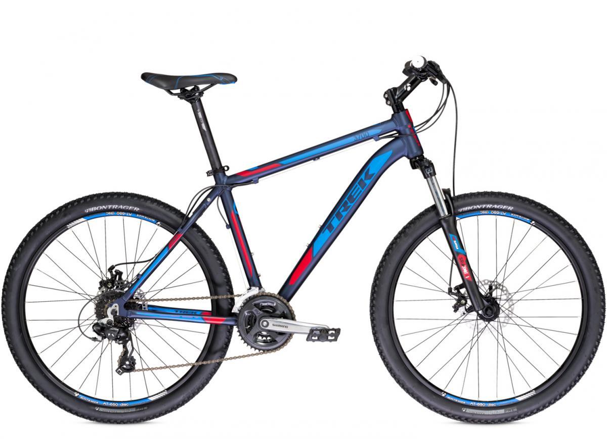 A modern mountain bike with a sleek blue and red frame, featuring front suspension, disc brakes, and rugged tires designed for off-road use. The bike is positioned to showcase its geometry, drivetrain components, and overall design.