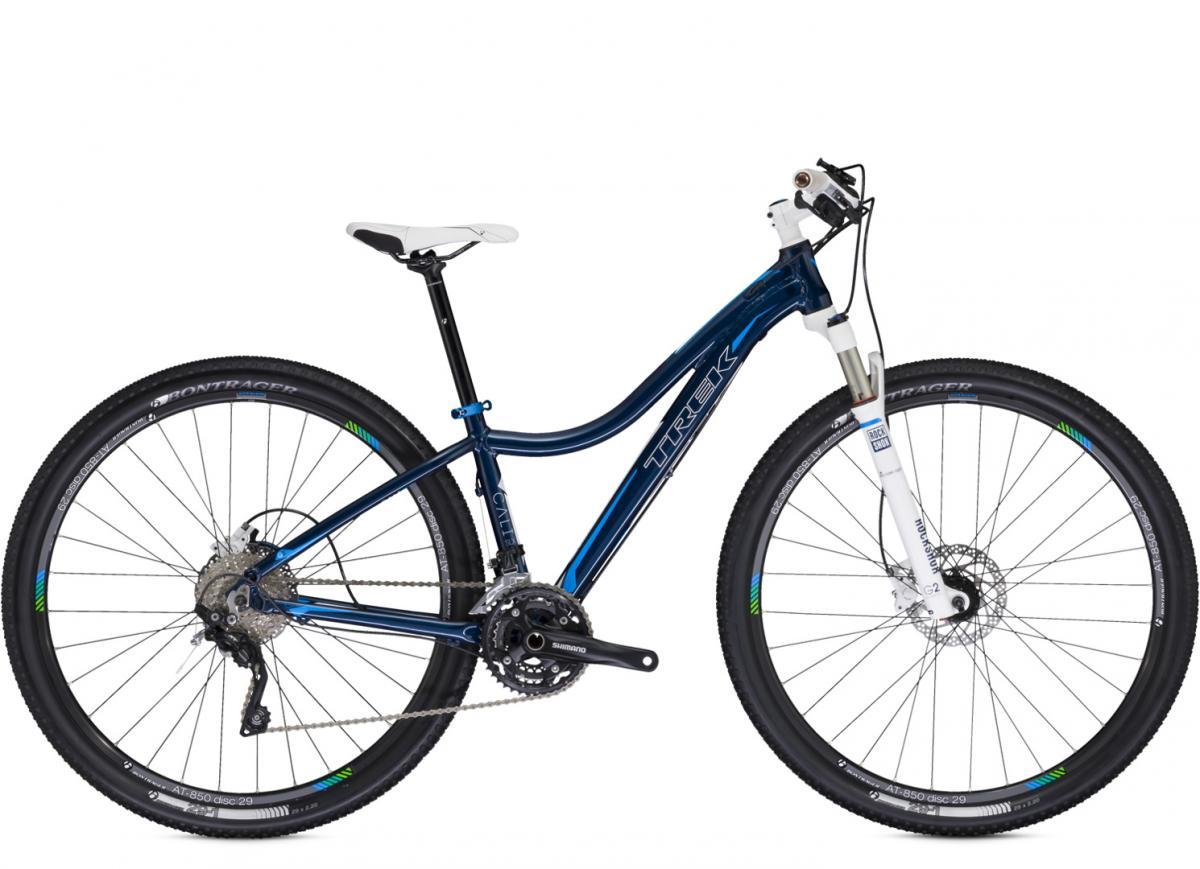 Trek Cali SLX: A blue Trek mountain bike with a sleek design, featuring a lightweight frame, front suspension, and disc brakes. The bike has a white saddle and is equipped with Bontrager tires suitable for trail riding.