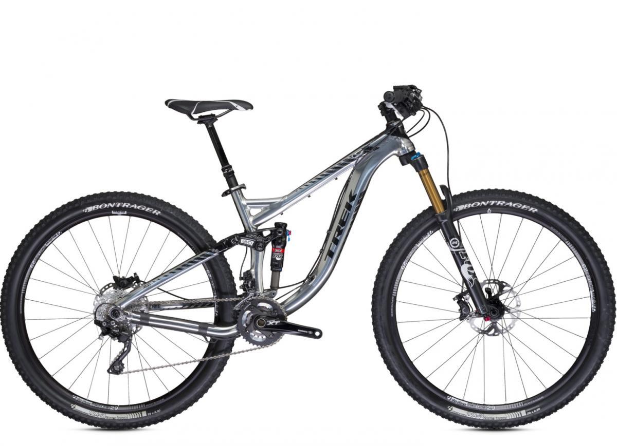 Trek Remedy: A silver mountain bike with front suspension and wide tires, featuring a sleek frame design and modern components, including Bontrager wheels and Shimano XTR drivetrain.