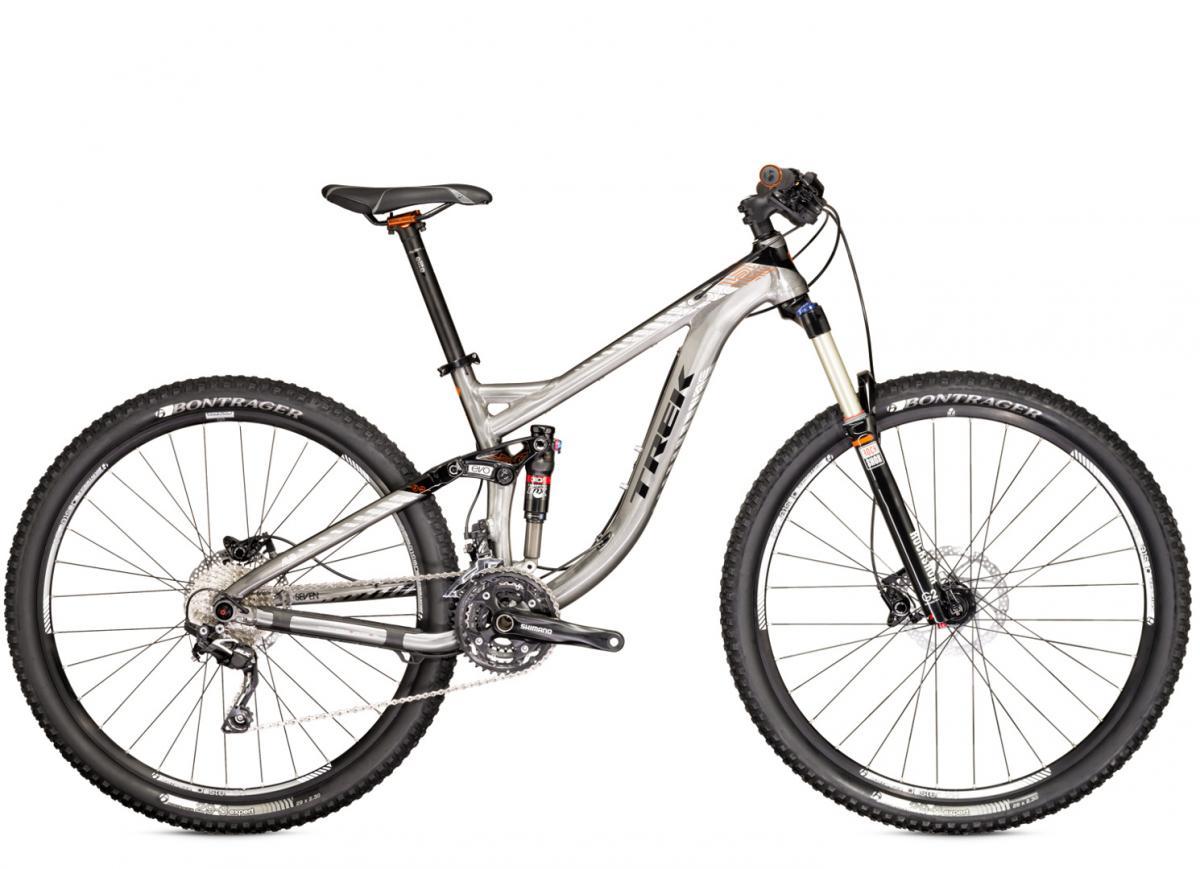 Trek Remedy 7 29: A silver and black mountain bike with a sleek design, featuring a lightweight aluminum frame, front suspension, and wide tires for off-road capabilities. The bike includes a Shimano drivetrain and Bontrager components, showcasing its versatility for various terrains.