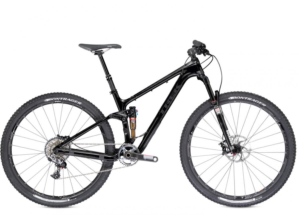 Trek Fuel EX 9.9 29 XX1: A sleek black mountain bike with a lightweight frame, featuring front suspension and wide tires. The bike is positioned against a plain white background, showcasing its design and components, including a modern drivetrain and disc brakes.