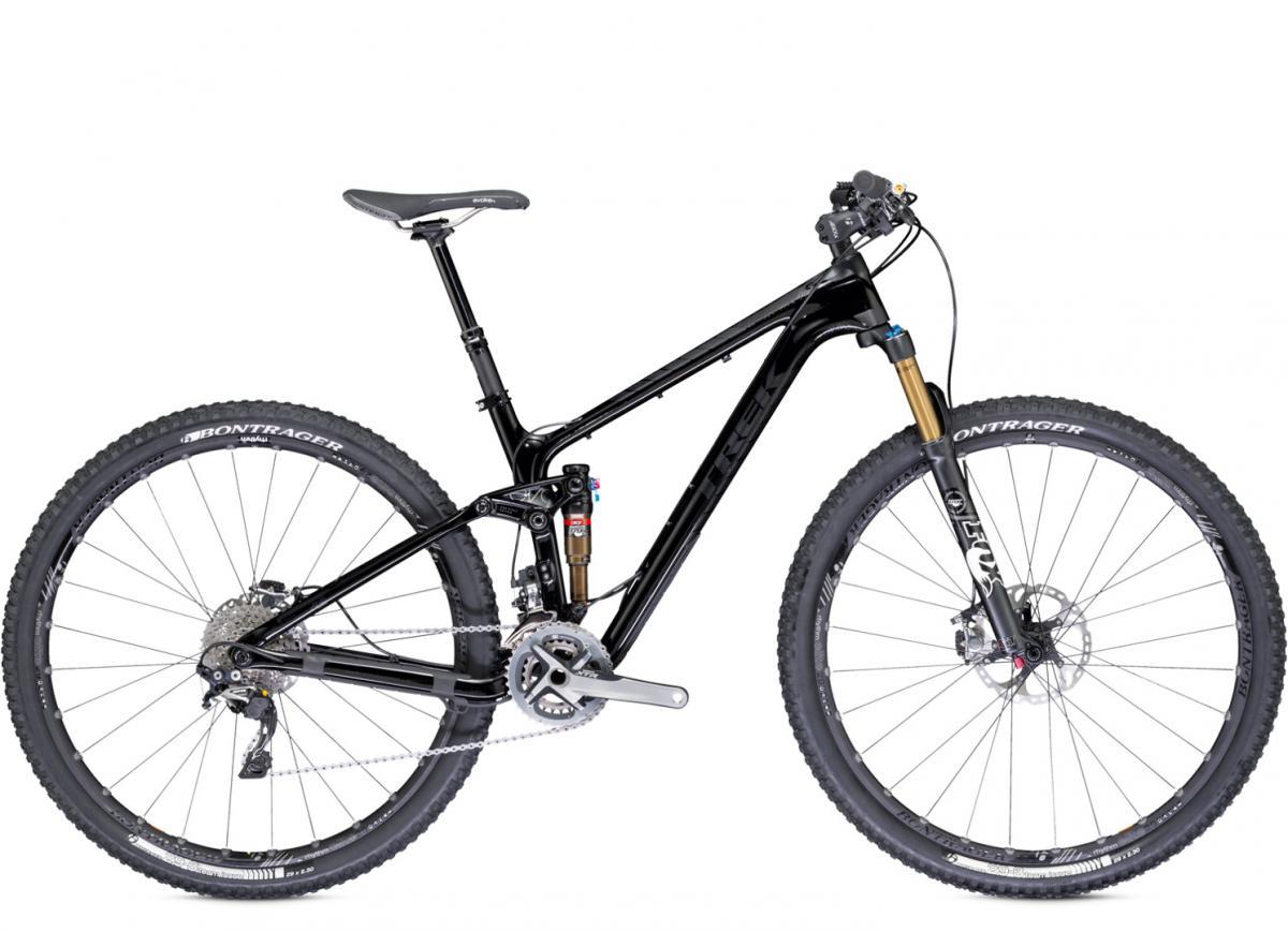 Trek Fuel EX 9.9 29 XTR: A black mountain bike featuring a lightweight frame, front suspension fork, and wide tires designed for off-road riding. The bike is equipped with a chain, gears, and hydraulic disc brakes for improved performance on rugged terrain.