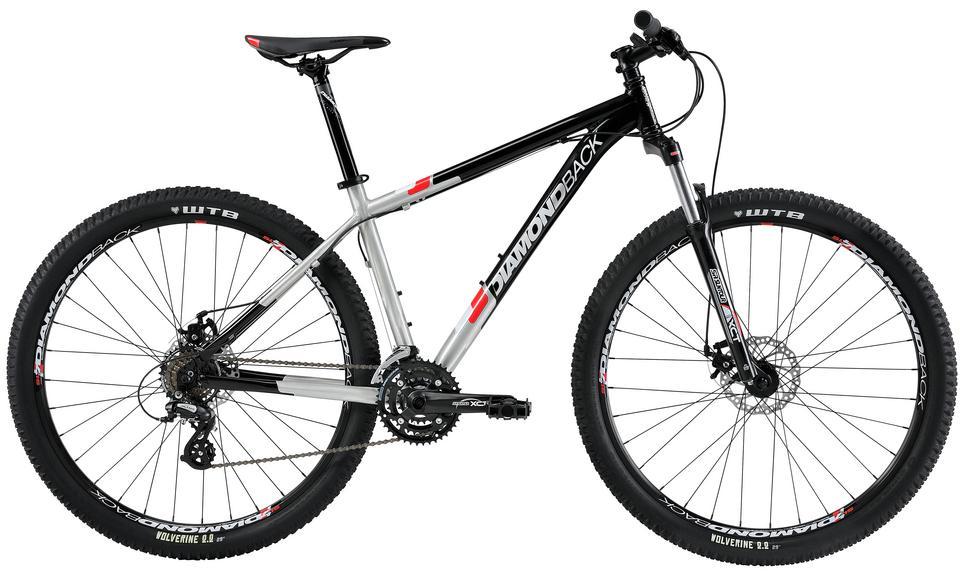 Diamondback Response 29: Alt text: A Diamondback mountain bike featuring a sleek black and silver frame, with wide tires and front suspension, positioned at a slight angle to showcase its design and components.