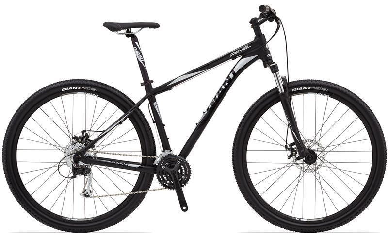 Giant Revel 29er: Black mountain bike with disc brakes, front suspension, and 27.5-inch wheels, featuring a sleek design and multiple gears.