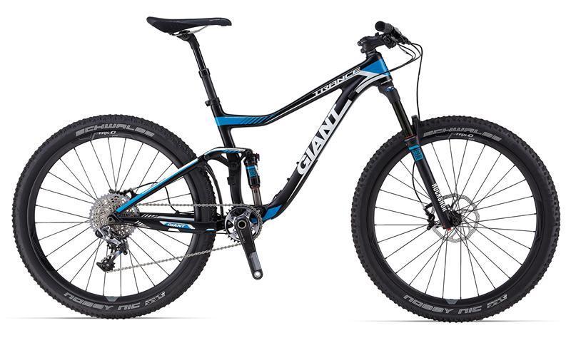 Giant Trance Advanced 27.5 0: A modern mountain bike featuring a sleek black and blue frame, equipped with wide tires and a suspension system for rugged terrain. The bike includes a gear system and disc brakes, designed for performance and versatility in outdoor cycling.