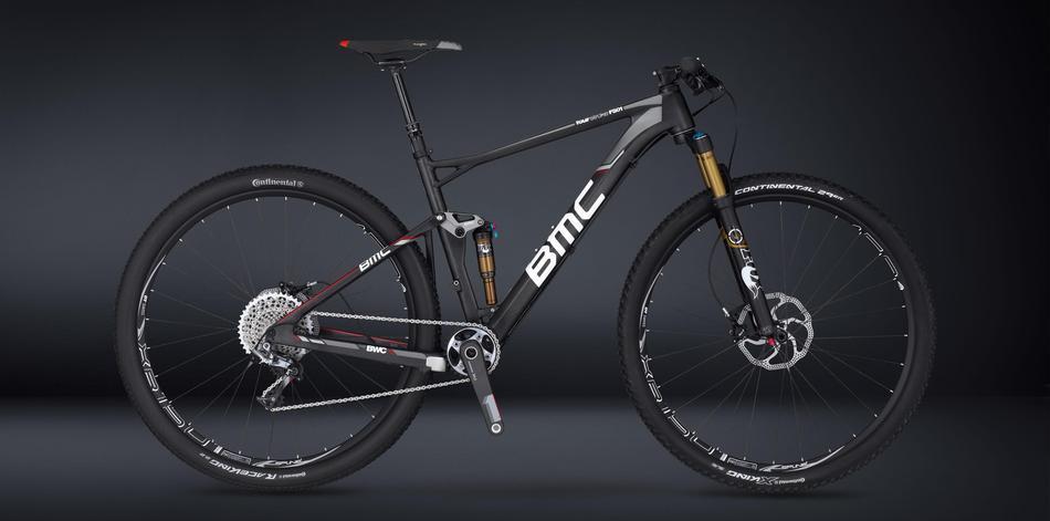 BMC Fourstroke FS01 29 XX1-Trailcrew: A sleek black mountain bike featuring a lightweight frame, advanced suspension system, and high-performance components. The bike is positioned against a dark background, highlighting its modern design and intricate details such as the logo and wheel specifications.