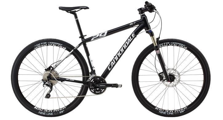 Cannondale Trail SL 29 2: Mountain bike with a black frame, 29-inch wheels, and front suspension. The bike features disc brakes, a lightweight design, and is branded with the name "Cannondale." The drivetrain includes a gear system mounted on the frame.