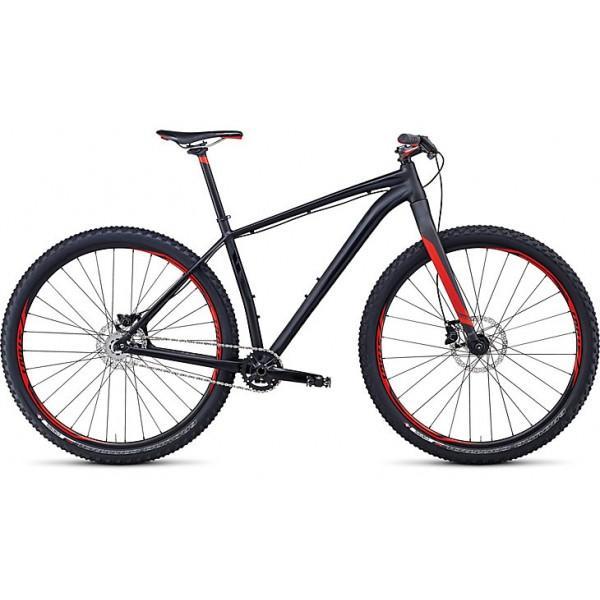 Specialized Crave SL 29: Mountain bike with a sleek black frame and red accents, featuring large tires, a lightweight design, and a front suspension system, positioned on a plain background.