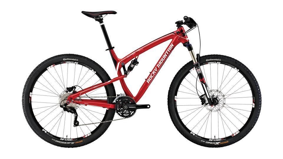 Rocky Mountain Element 930: A red mountain bike with a lightweight frame, front suspension, and disc brakes, featuring Continental tires designed for off-road terrain. The bike is positioned against a plain background for clear visibility.