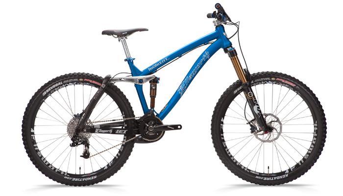 Ellsworth Moment sst.2: A blue mountain bike with a lightweight aluminum frame, front suspension fork, and wide tires. The bike features disc brakes and a modern design, suitable for off-road cycling. It is positioned against a plain background, showcasing its sleek lines and components.