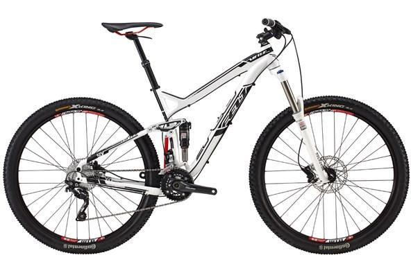 Felt Virtue Nine 50: A white mountain bike with black and red accents, featuring a lightweight frame, front suspension fork, and wide tires suitable for rugged terrain. The bike is positioned on a plain background, highlighting its design and components.