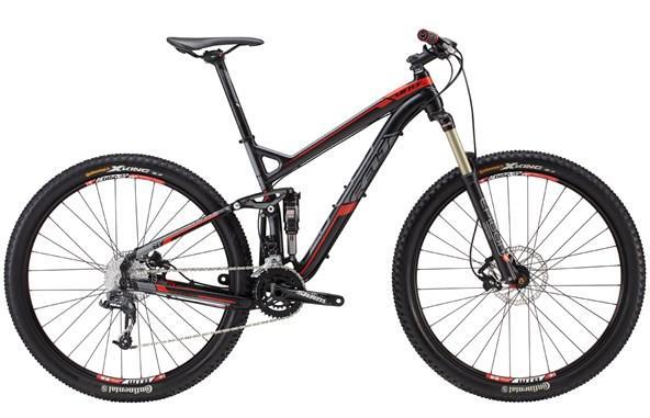 Felt Virtue Nine 60: A modern mountain bike with a black and red frame, featuring dual suspension and wide knobby tires, suitable for off-road riding. The bike is equipped with a front shock absorber, disc brakes, and a gear shift mechanism, showcasing a sleek and aerodynamic design.