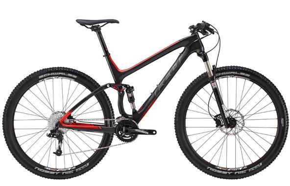 Felt Edict Nine 3: A sleek mountain bike featuring a lightweight carbon fiber frame with a black and red color scheme. It has thick, knobby tires designed for off-road terrain and a suspension fork for enhanced shock absorption. The bike is designed for performance and durability, ideal for trail riding.