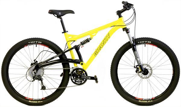 Gravity FSX2750 DS: A bright yellow and black mountain bike featuring a full suspension frame, wide tires, and a 3x drivetrain system. The bike is designed for rugged terrain, showcasing disc brakes and a prominent brand logo on the frame.