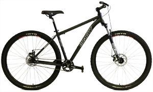 Gravity G29FS: A black mountain bike with wide tires, a sturdy frame, and a single front suspension fork, positioned against a white background.