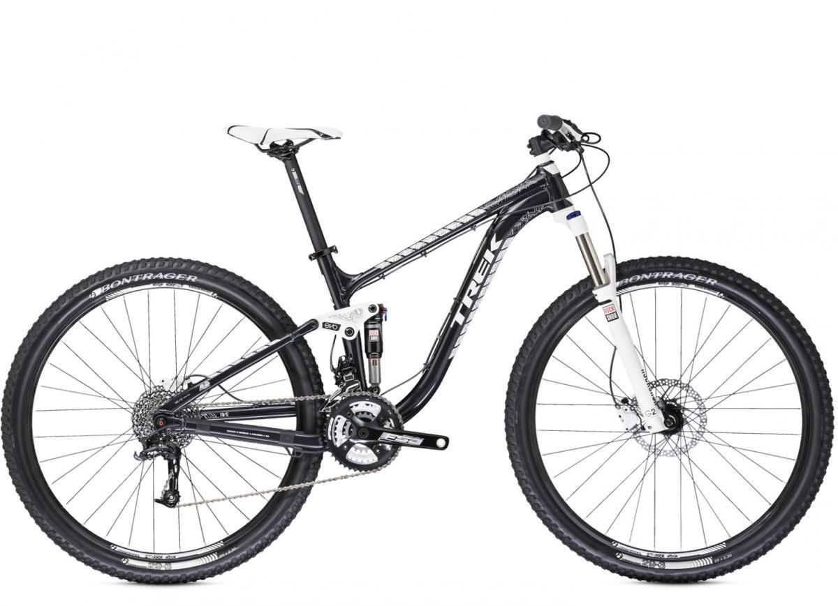 Trek Fuel EX 5: Alt text: A black and white mountain bike with suspension features and thick tires, positioned at an angle to showcase its frame and components. The bike has a lightweight design suitable for rugged terrain.