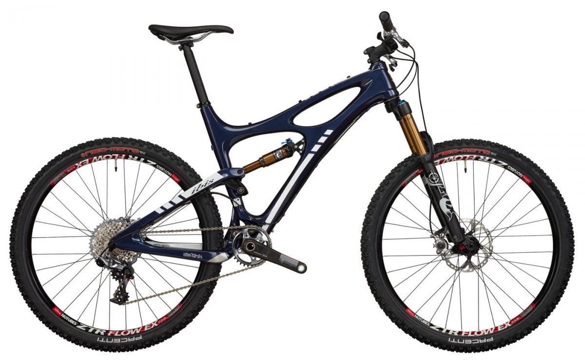 Ibis Mojo HDR 650b: A modern mountain bike featuring a sleek dark blue frame, dual suspension, and rugged tires, equipped with hydraulic disc brakes and a high-performance drivetrain. The bike is positioned against a plain background, showcasing its design and components.