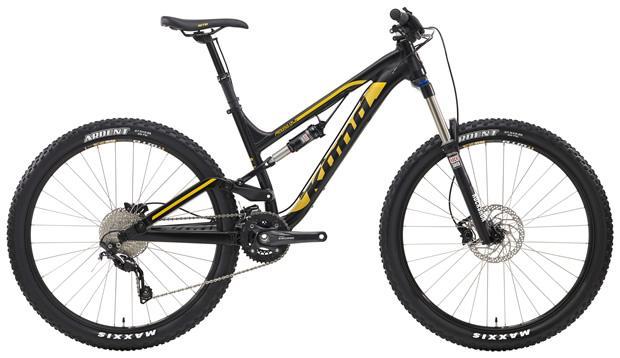 Kona Process 134: A black and yellow mountain bike with a dual suspension system, featuring wide tires and a modern design. The bike has a sleek frame, a prominent fork, and a geared drivetrain, ideal for off-road trails.