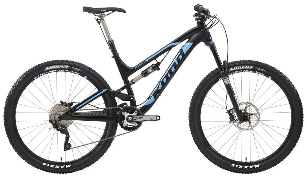 Kona Process 134 DL: Mountain bike with a black and blue frame, featuring wide tires and a sturdy suspension system, designed for off-road cycling. The bike is equipped with disc brakes and has a modern design, showcasing its high-quality components.