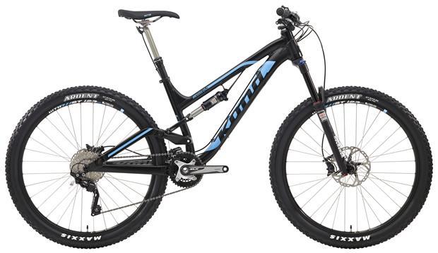 Kona Process 134 DL: A black and blue mountain bike with a sleek design, featuring front suspension, disc brakes, and knobby tires suitable for off-road riding. The frame has a modern shape with a prominent brand logo and is equipped with a variety of gears for different terrains.