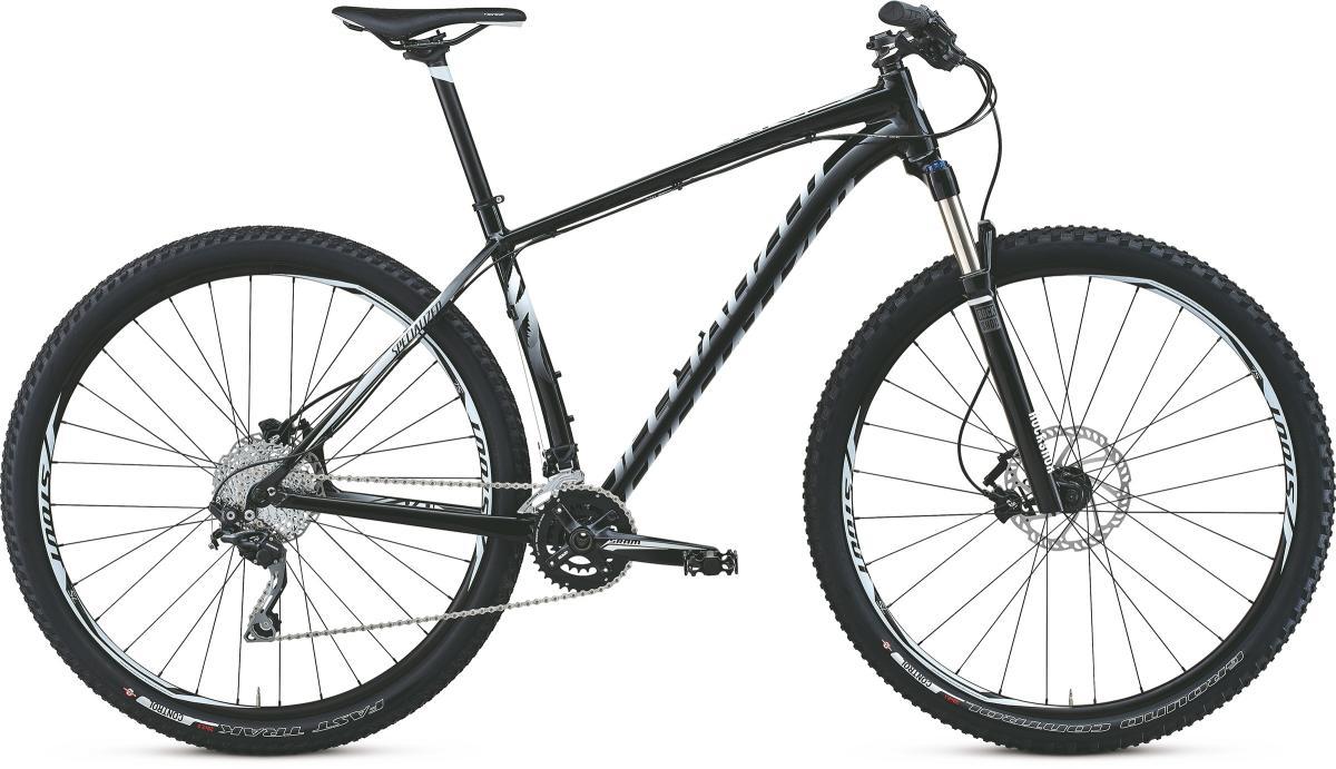 Specialized CRAVE 29: A black and silver mountain bike with wide tires and a lightweight frame, featuring a front suspension fork, disc brakes, and a gear system. The bike is positioned on a white background.