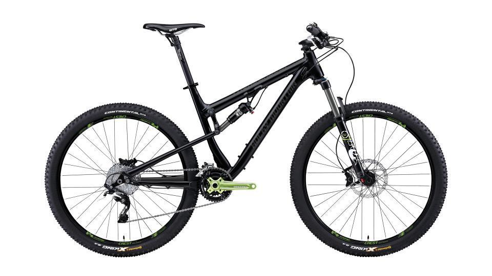 Rocky Mountain Thunderbolt: A black mountain bike with green accents, featuring wide tires and a dual suspension system. The bike is positioned to show both the front and side view, highlighting its sleek design and sturdy frame. The handlebars are equipped with brake levers, and the drivetrain components are visible, showcasing its performance-oriented features.