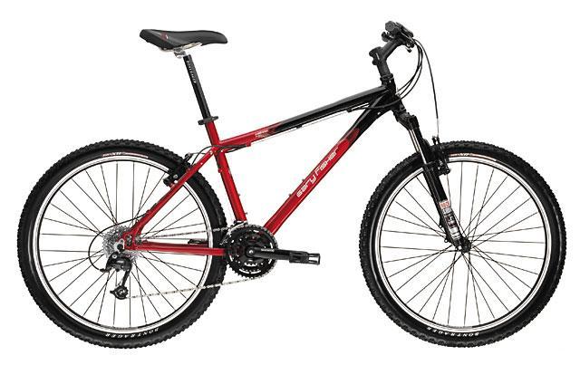 Trek Wahoo: A black and red mountain bike featuring wide tires, a dual suspension system, and a traditional frame design. The bike has a comfortable saddle, textured grip handlebars, and multiple gears, making it suitable for off-road cycling and rugged terrains.