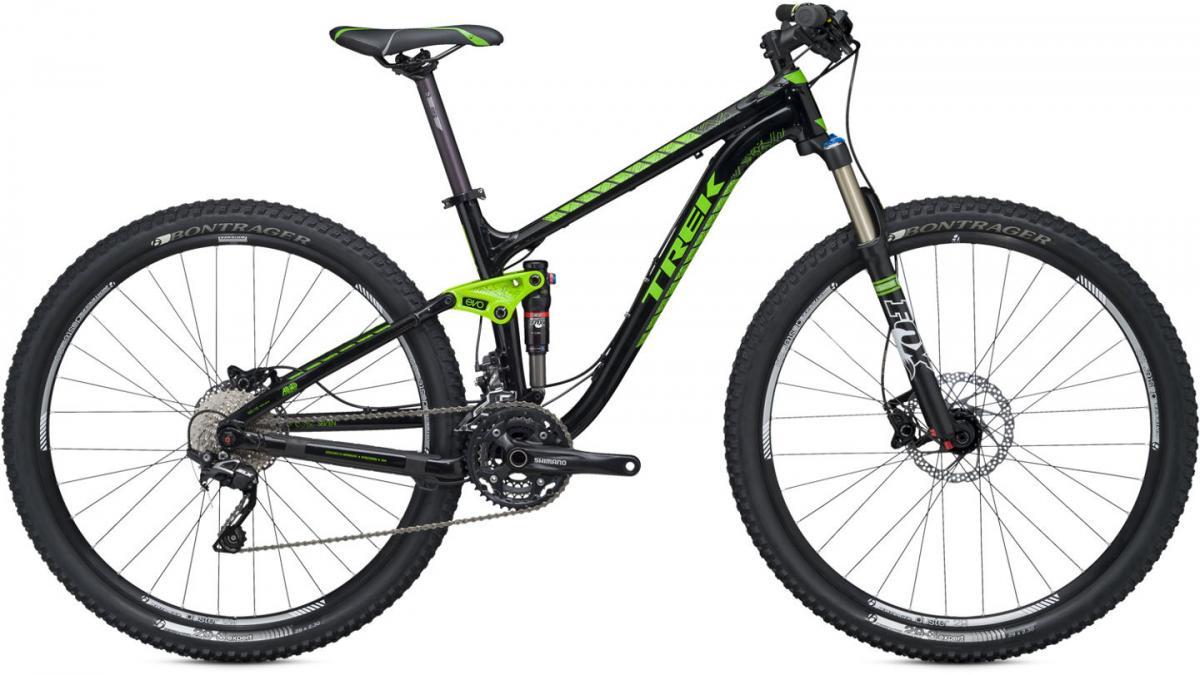 Trek Fuel EX 7 29: Alt text: A black and green Trek mountain bike with wide tires and a lightweight frame, featuring a suspension system, Shimano components, and Bontrager wheels. The bike is displayed from the side, showcasing its design and features.