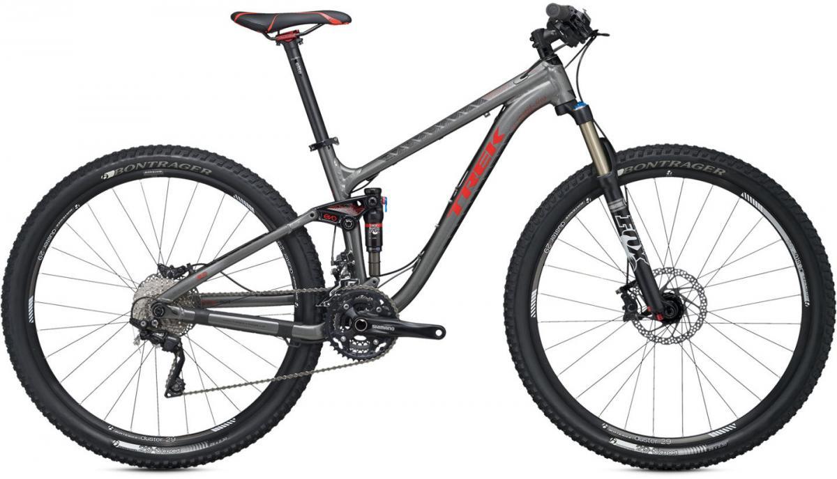 Trek Fuel EX 8 29: Alt text: A sleek gray mountain bike featuring a lightweight frame, red accents, and a variety of high-performance components including Shimano gears and Bontrager tires. The bike is displayed against a plain background.
