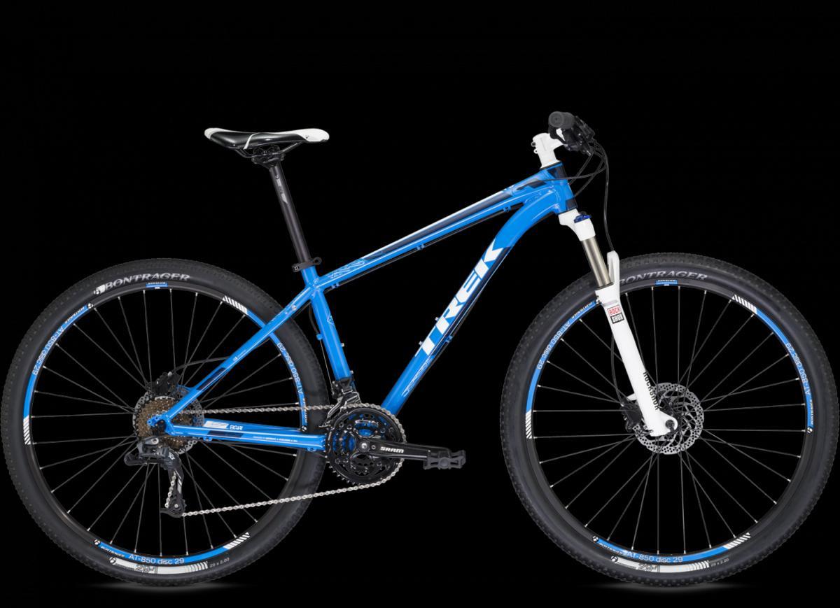 Trek X-Caliber 8: A blue mountain bike with a lightweight frame, featuring a front suspension fork, disc brakes, and knobby tires. The bike is shown against a black background, highlighting its sporty design and components.