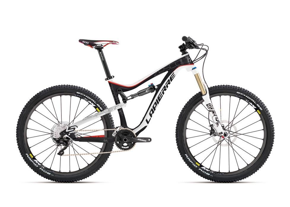 Lapierre Zesty AM 327: A black and white mountain bike with red accents, featuring front suspension, wide tires with a tread pattern suitable for off-road riding, and modern gear components. The bike is positioned at an angle to showcase its sleek frame and design details.