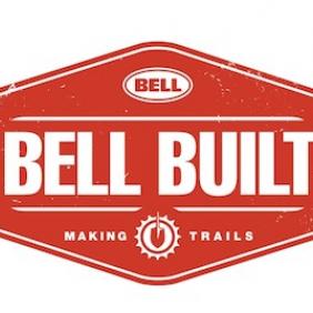 Logo of Bell Built, featuring a red diamond-shaped design with the words "BELL BUILT" prominently displayed in white. Below, the tagline reads "MAKING TRAILS," accompanied by a gear icon.