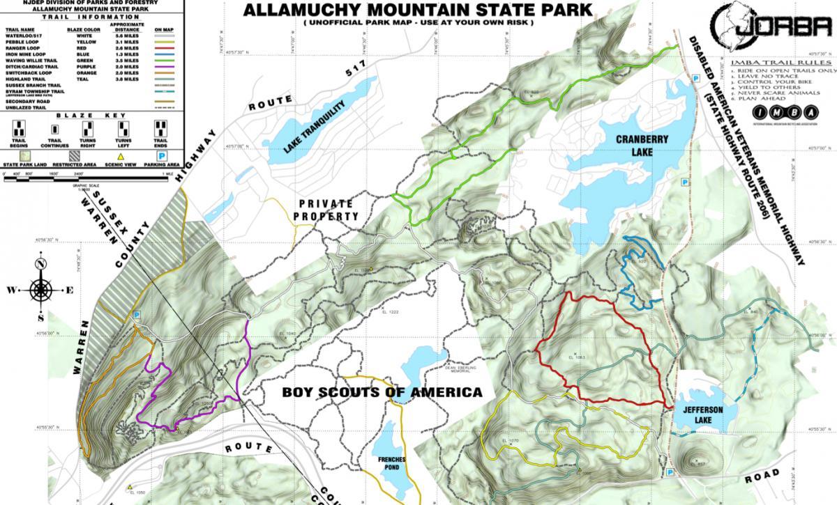 Map of Allamuchy Mountain State Park, featuring various trails marked by colored blazes, including Waterloop, Iron Mine Loop, and Switchback Loop. Key information includes trail lengths, directions, and designated areas such as private property and Boy Scouts of America. Notable landmarks include Cranberry Lake, Jefferson Lake, and Lake Tranquility. Map indicates restricted areas and parking locations. Allamuchy State Park-North mountain bike trail.