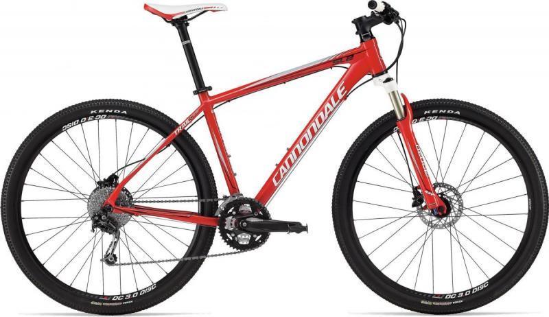 Cannondale Trail SL 29: A bright red Cannondale mountain bike with a lightweight aluminum frame, featuring knobby tires for off-road traction, disc brakes, and a modern design. The bike is displayed at an angle to showcase its components and frame structure.