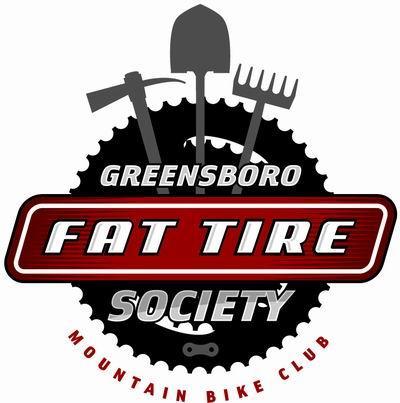 Logo of the Greensboro Fat Tire Society, a mountain bike club. The design features a circular gear with the club name prominently displayed in bold red text. Above the text, there are illustrations of a shovel, a pickaxe, and a rake, symbolizing trail maintenance and mountain biking activities.