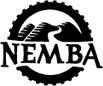 Logo of NEMBA, featuring the text "NEMBA" within a circular design that includes stylized hills and a mountain bike tire tread.