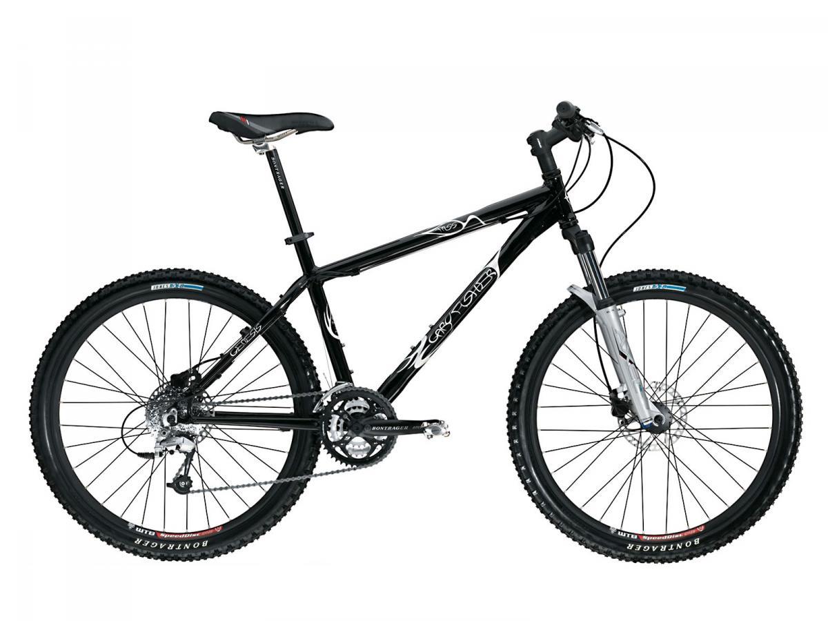 Gary Fisher Tassajara Disc: A black mountain bike with a silver front suspension fork, featuring knobby tires, a multi-gear drivetrain, and a black saddle. The bike is positioned to show its full frame and components against a simple white background.