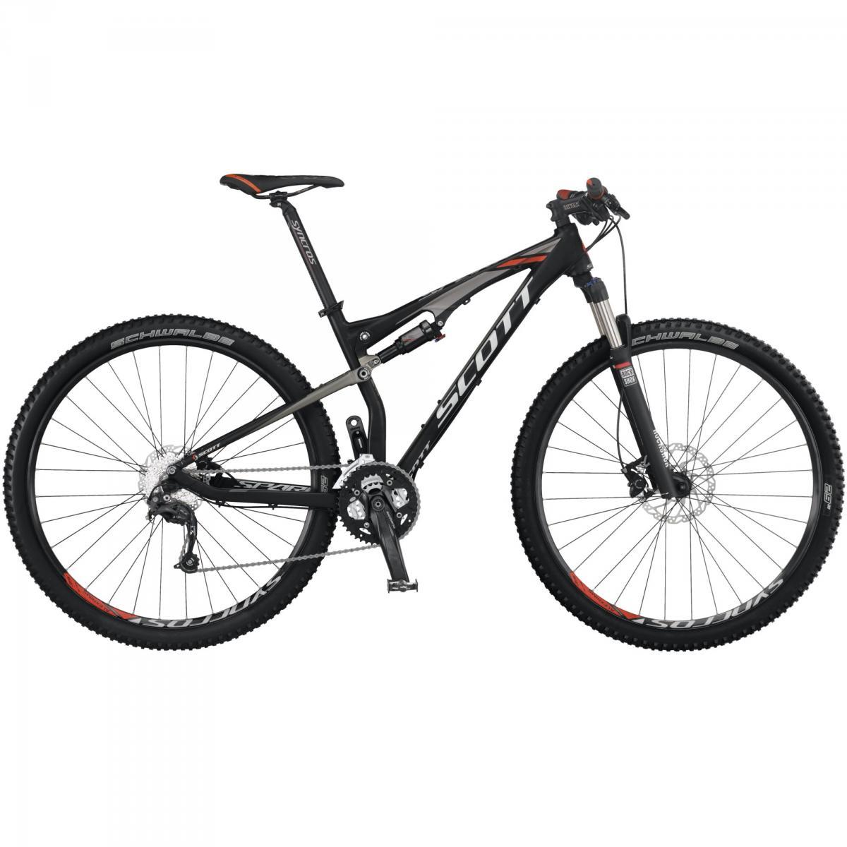 Scott Spark 960: Mountain bike with a black and gray frame, featuring large tires and a dual suspension system. The bike is equipped with disc brakes and multiple gearing options for off-road performance.