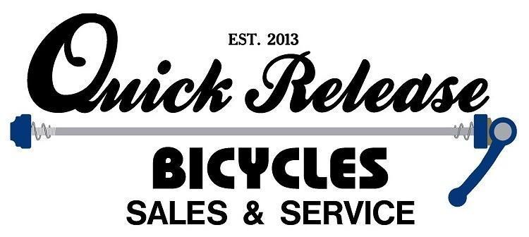 Logo for Quick Release Bicycles, established in 2013, featuring the company name in an elegant font with a bicycle component illustration incorporated into the design. Text includes "Bicycles Sales & Service."