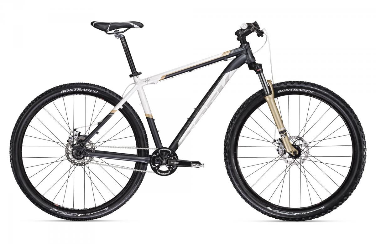 Trek Marlin: A black and white mountain bike featuring a front suspension fork, wide tires with tread, and a sleek frame design, positioned against a plain white background.