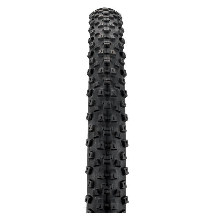 Forte Pisgah 26x2.3: A close-up view of a black bicycle tire with a rugged tread pattern, designed for traction on various terrains. The tire is shown from a frontal perspective, highlighting its textured surface and distinctive protrusions.