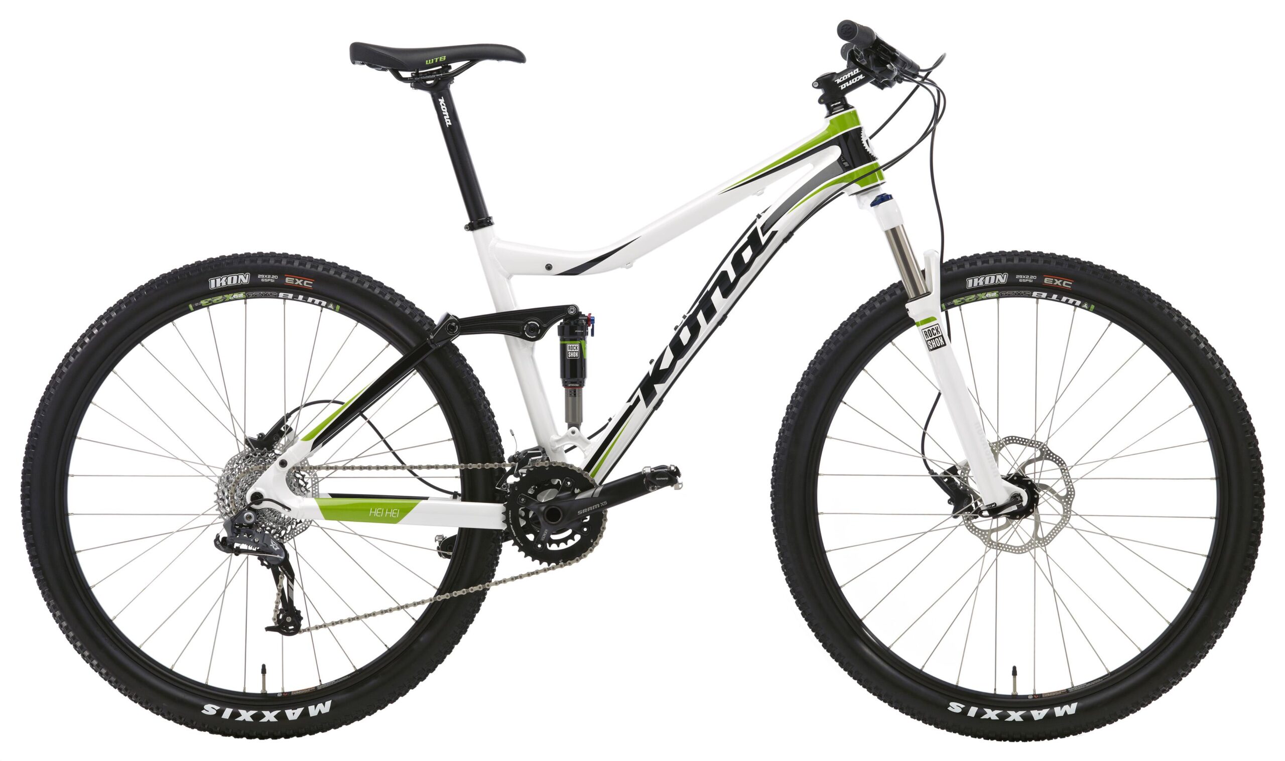 Kona Hei Hei 2-9: A side view of a modern mountain bike featuring a sleek white and green frame, equipped with disc brakes and rugged tires. The bike has a dual suspension system and a variety of gears, designed for off-road cycling adventures.