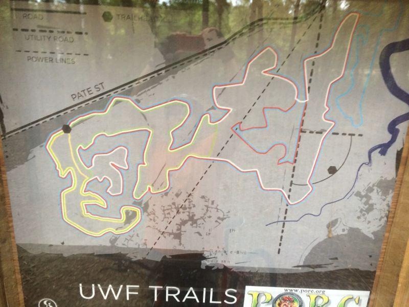 Map of UWF Trails highlighting various paths and trails, with color-coded lines indicating different routes. The map includes labels for Pate Street and marking of roads, utility roads, and power lines within the area. UWF Mountain Bike Trails mountain bike trail.
