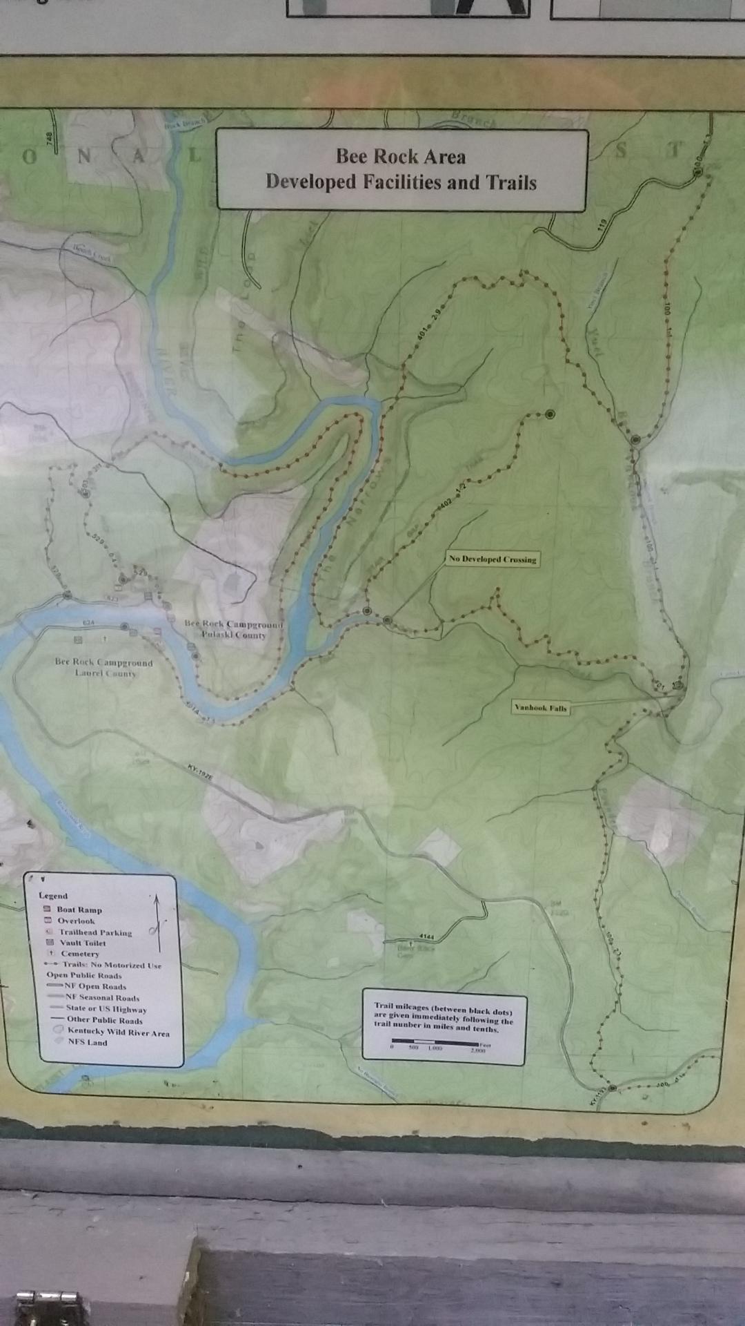 Map of the Bee Rock Area, detailing developed facilities and trails, including campgrounds, hiking routes, and water bodies. The map features a legend with symbols for boat ramps, viewpoints, trailheads, and roads, along with trail mileage information. Cane Creek (sheltowee Trace Trail) mountain bike trail.