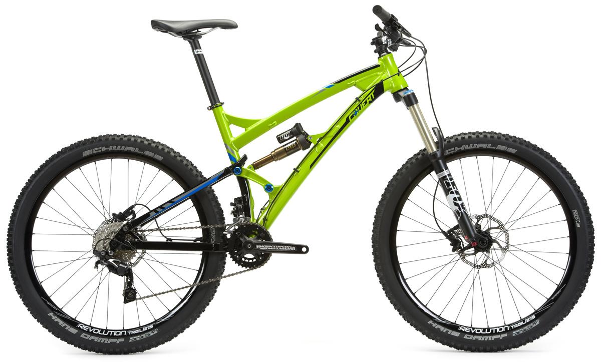 Transition Covert 27.5: A vibrant green mountain bike with a sleek frame design, featuring wide black tires and front suspension. The bike is positioned on a white background, showcasing its components, including a Shimano rear derailleur and hydraulic disc brakes.
